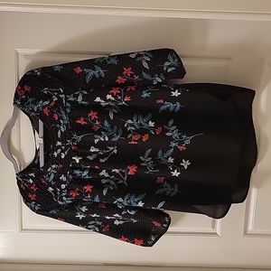 Festive Black/Floral Blouse with 3/4 Sleeves with Button Closure, Size Medium.